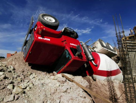 Construction closes after cement mixer overturns Construction closes after cement mixer overturns