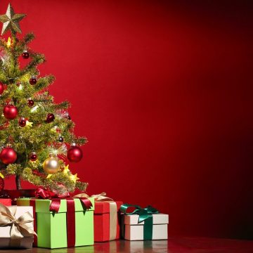What is typically done in town in the way of gift giving and tipping during Christmas season?
